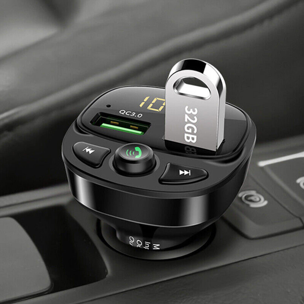 Black wireless car FM transmitter and dual USB phone charger plugged into vehicle socket. — view 2