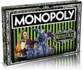Monopoly Beetlejuice board game box featuring iconic green theme character illustrations and custom playing pieces