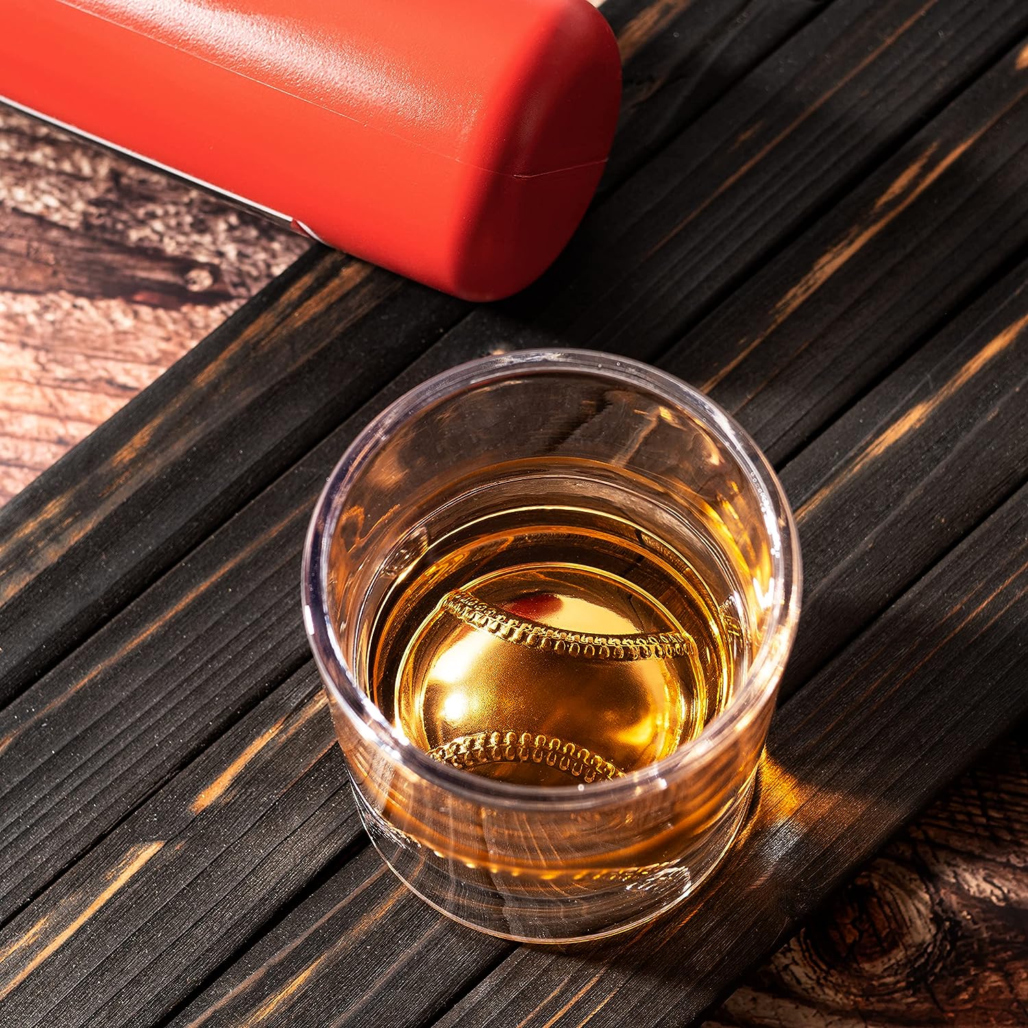 Clear 12oz baseball whiskey glass with a sculpted floating baseball design in the bottom base — view 2