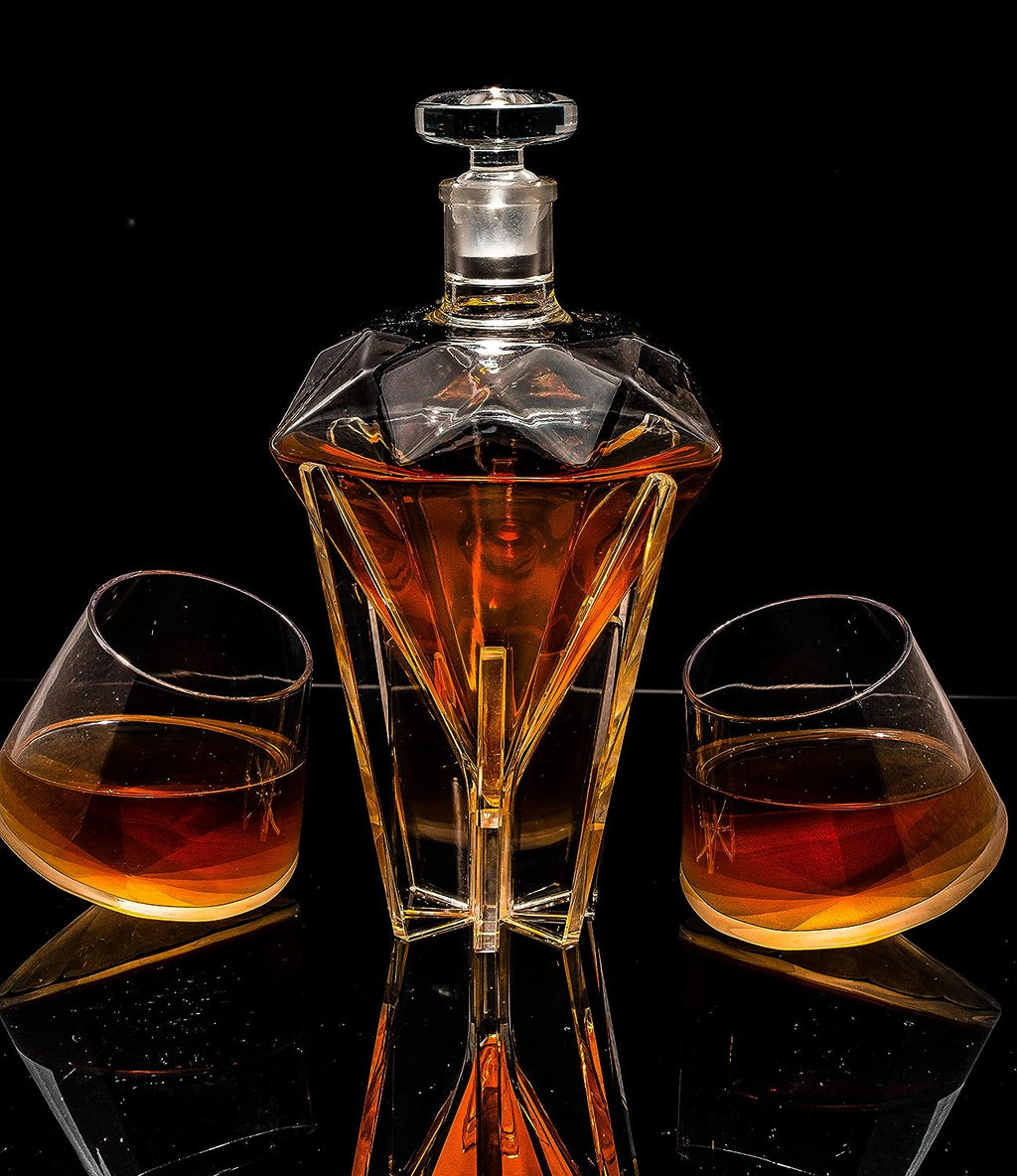 Diamond shaped glass whiskey decanter on a clear base with two matching diamond glasses. — view 2