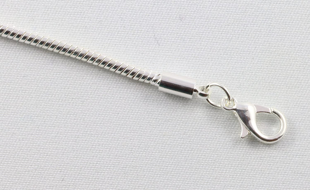 Silver plated Fleur de Lis charm bracelet on a sleek snake chain for men and women — view 3