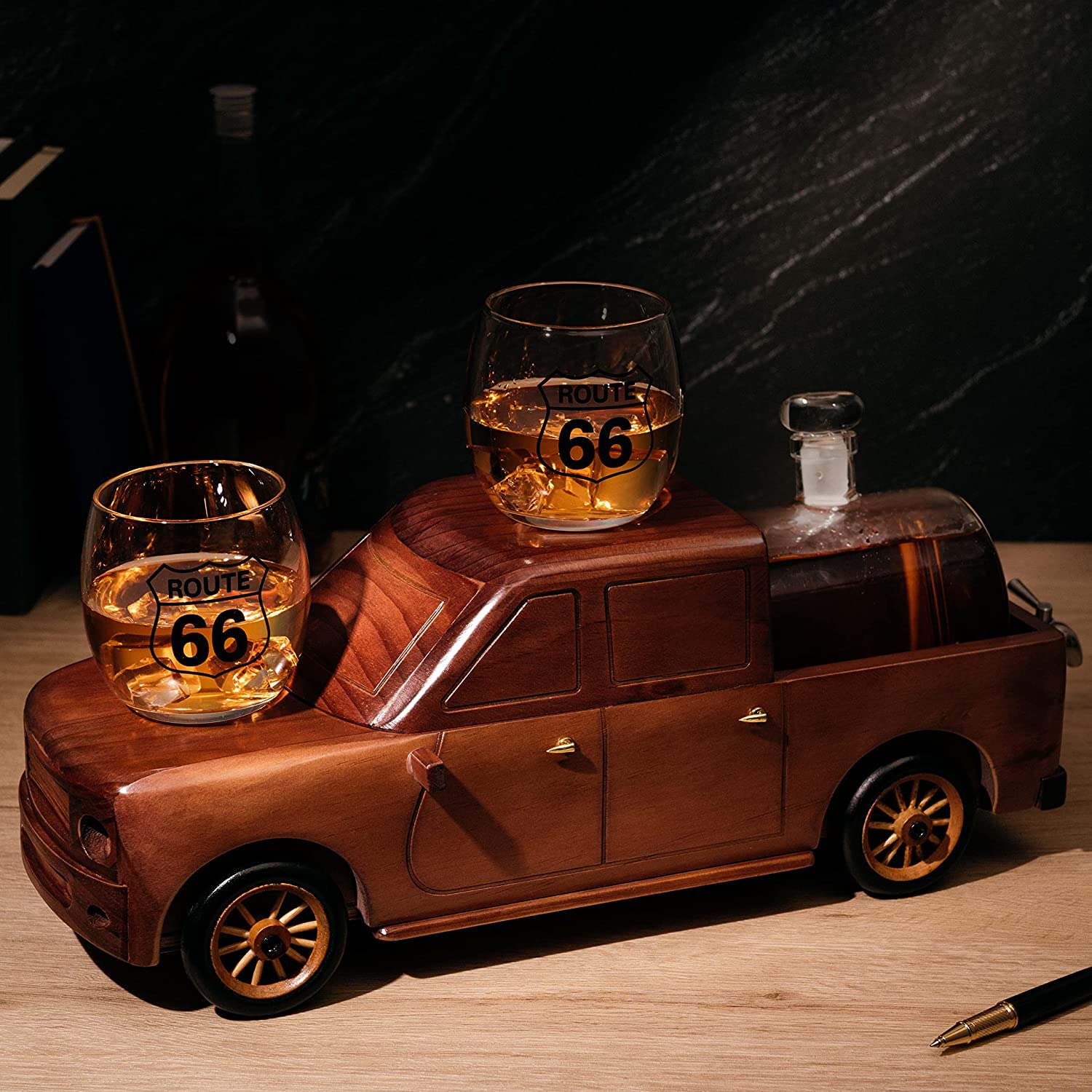 500ml glass barrel whiskey decanter resting in a wooden pickup truck display with two clear glasses — view 3