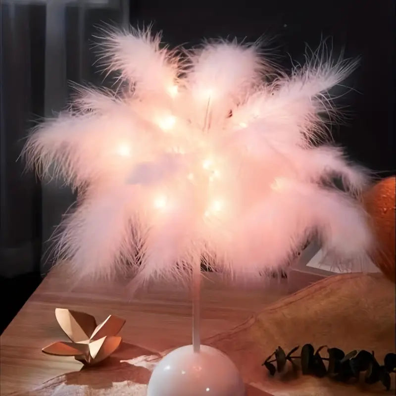 Pink feather touch table lamp emitting a soft cozy glow for bedroom interior decor — view 4