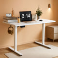White electric adjustable height standing desk with solid steel frame and spacious 40x24 desktop.