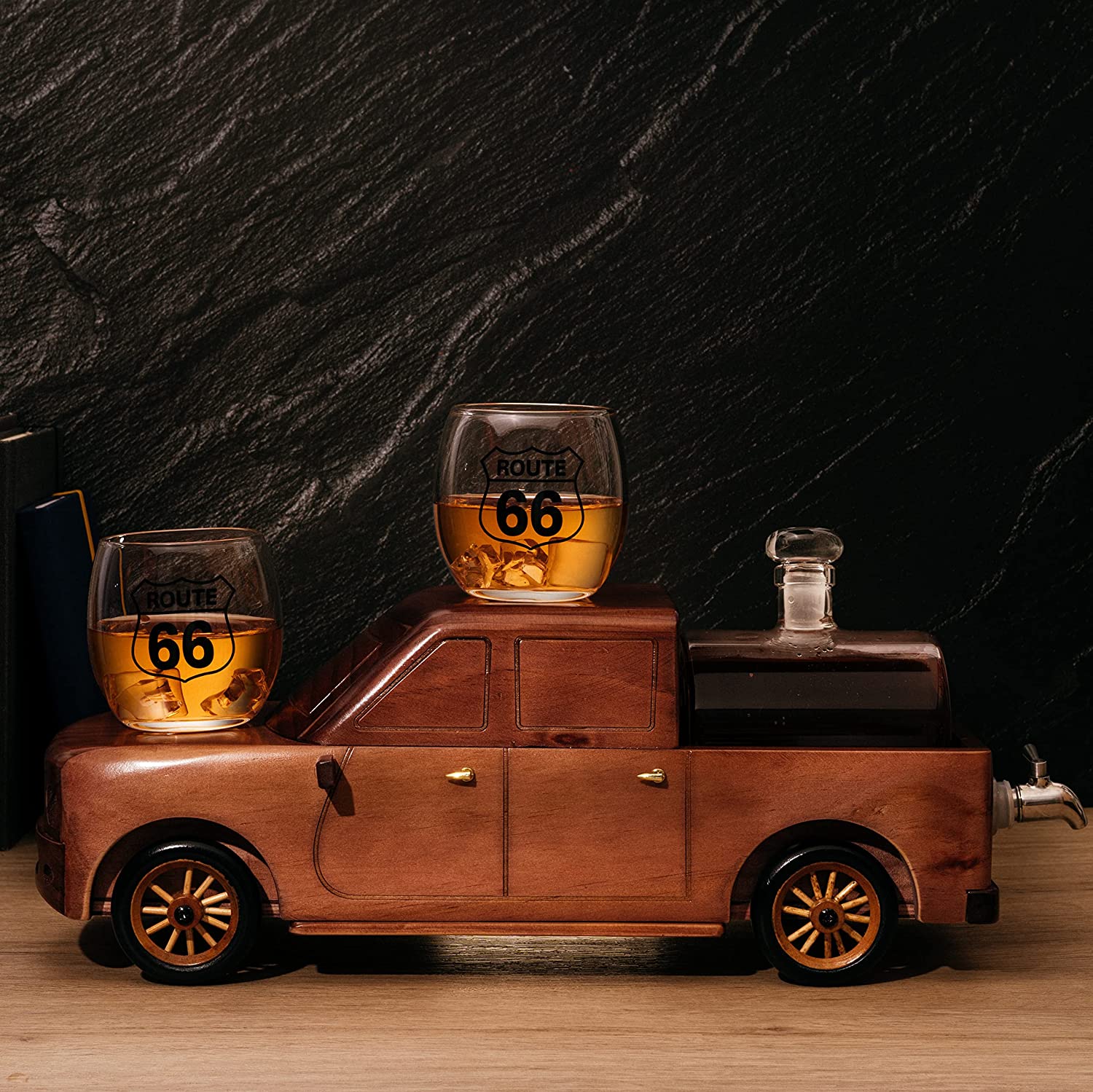 500ml glass barrel whiskey decanter resting in a wooden pickup truck display with two clear glasses — view 2