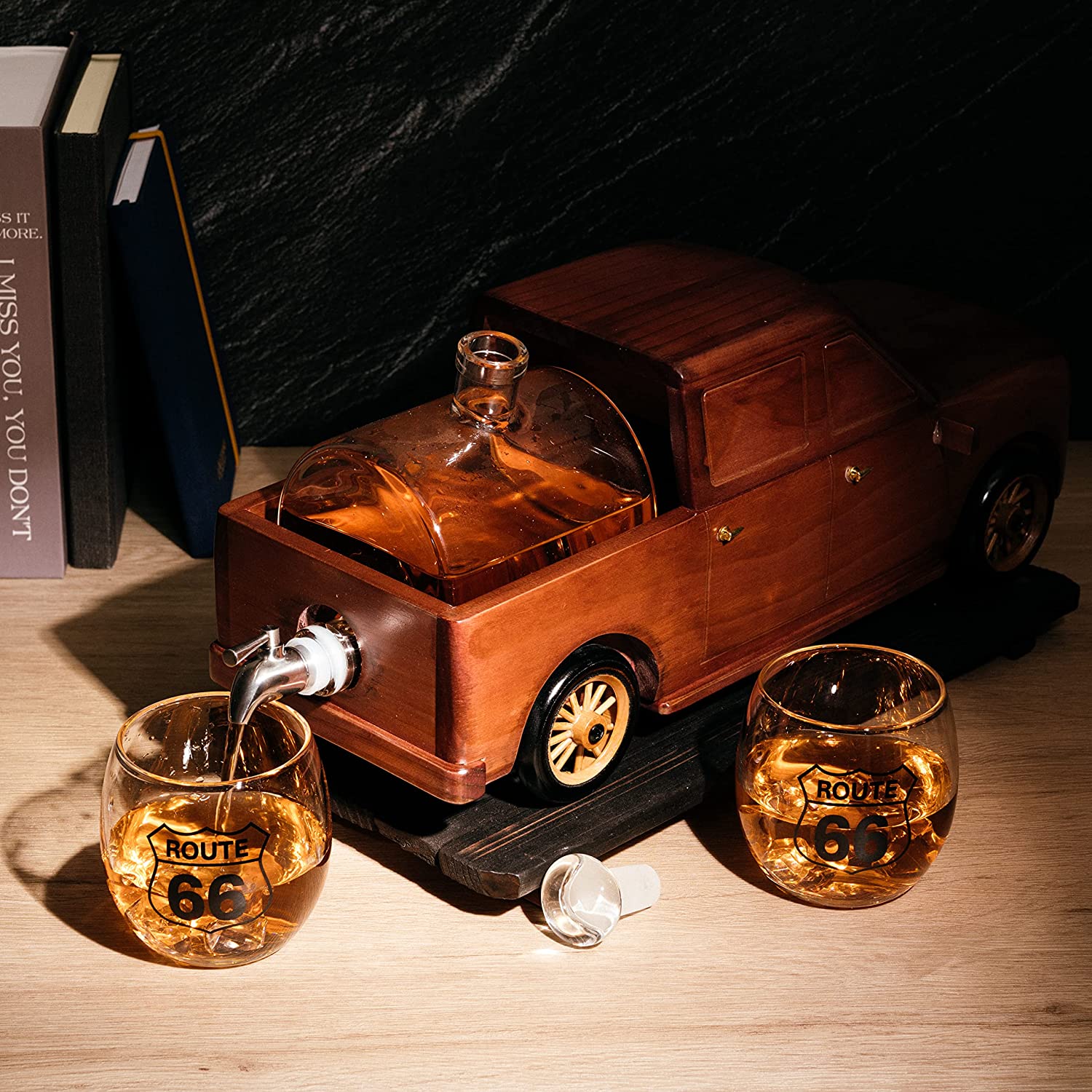 500ml glass barrel whiskey decanter resting in a wooden pickup truck display with two clear glasses — view 5