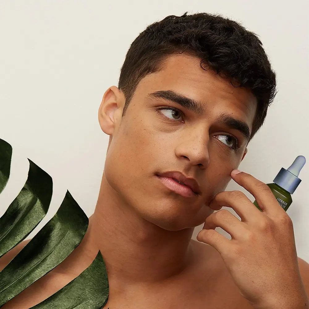 Herban Wisdom facial oil in half size dropper bottle, featuring botanical extracts for glowing skincare. — view 2