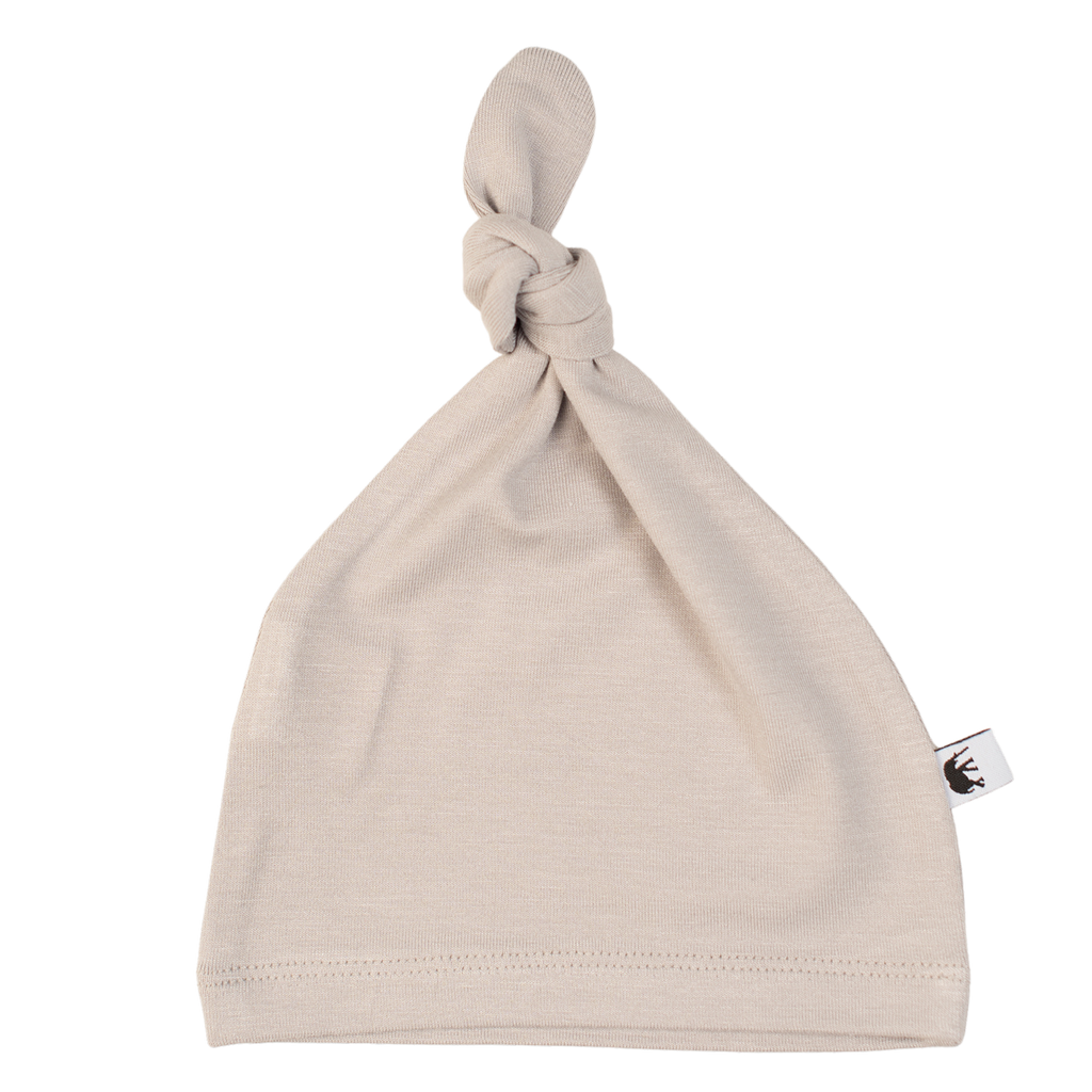 Grey bamboo baby beanie, soft stretchy headwear accessory for sensitive newborn skin.