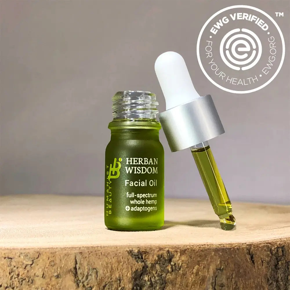 Herban Wisdom Facial Oil mini travel bottle with botanical serum for glowing skin