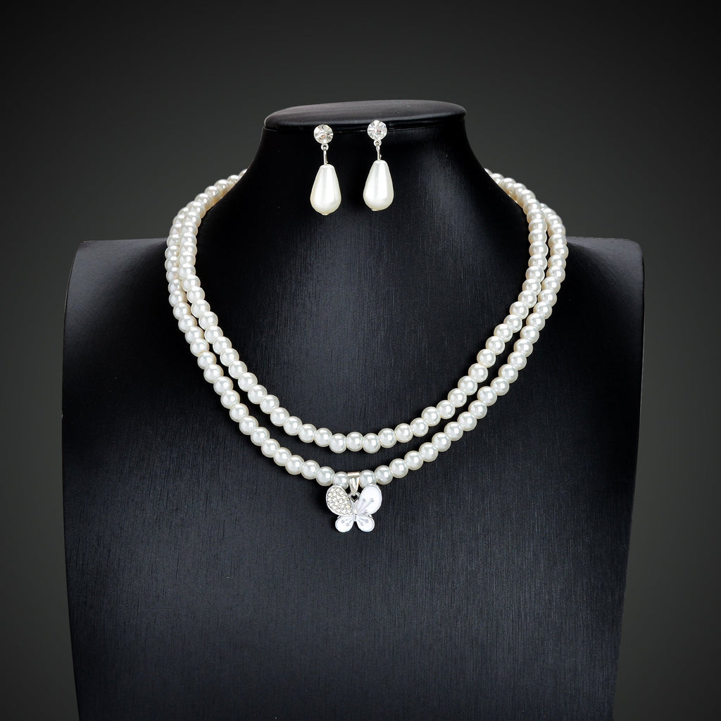 Imitation pearl jewelry set featuring a double layered necklace and matching water drop earrings — view 2