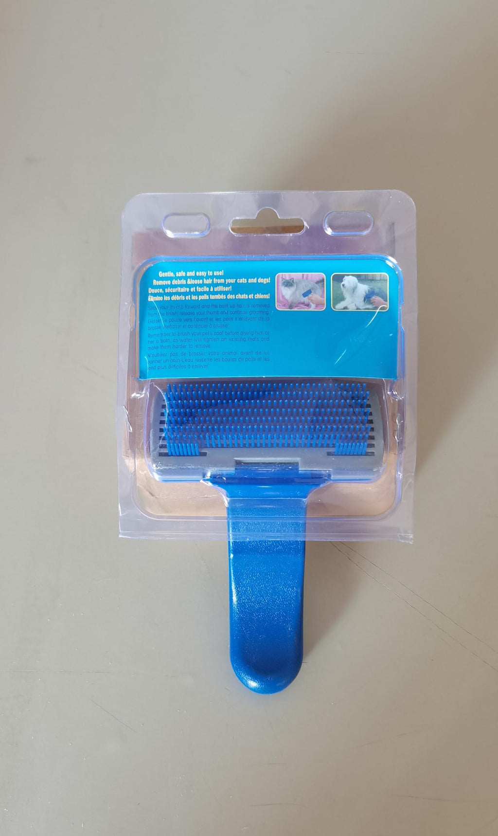 Self-cleaning pet hair grooming tool and brush with ergonomic handle for dogs and cats — view 4