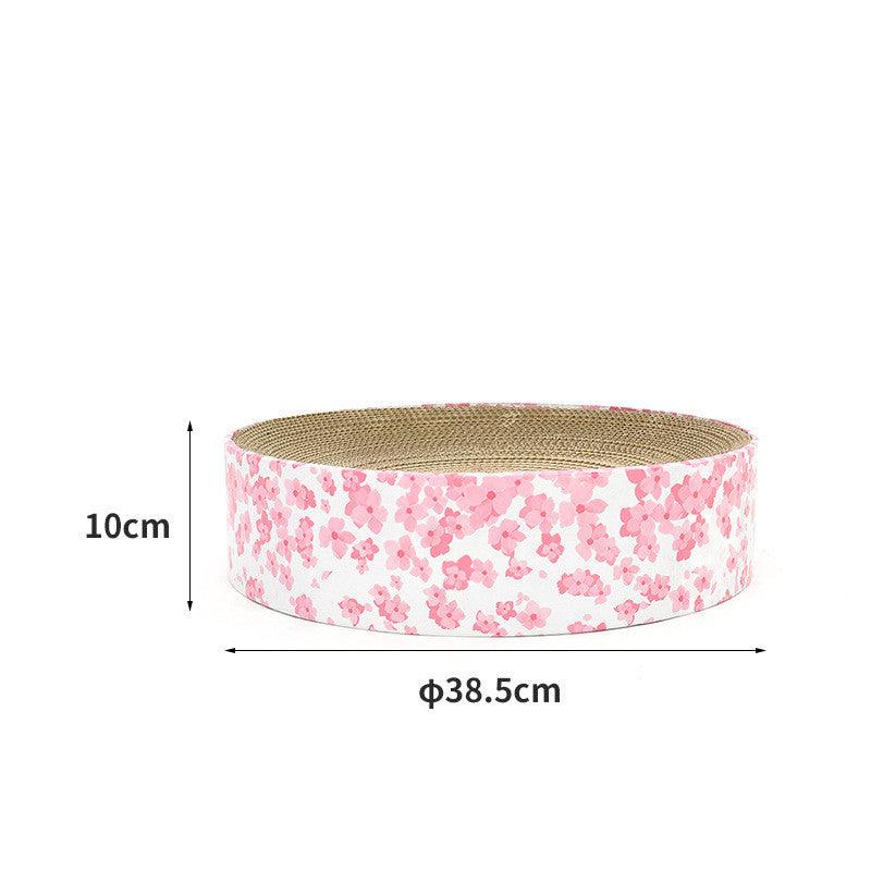 Round corrugated cat scratcher with wooden frame serving as a modern indoor pet lounge — view 2