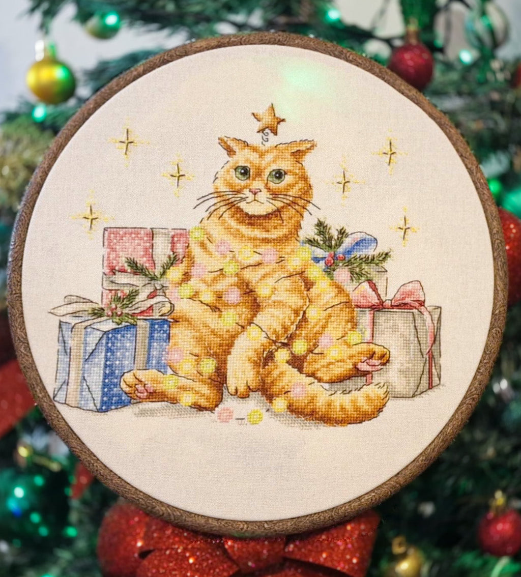 Festive orange cat cross stitch pattern design featuring colorful garland and a Christmas star. — view 5
