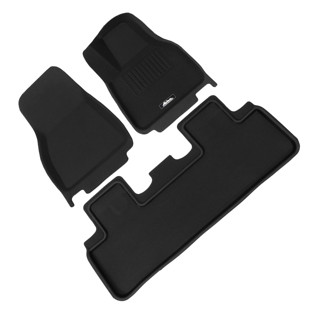 Custom moulded black rubber front and rear floor mats for Tesla Model Y interior protection. — view 2