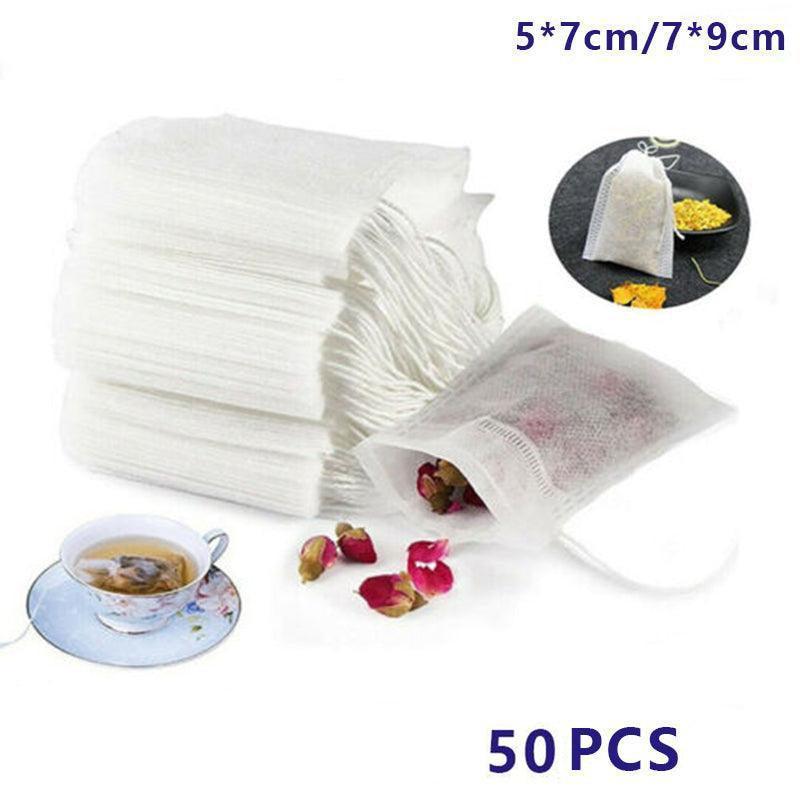 Set of 50 beige cotton muslin drawstring filter bags for tea, spices, and soup preparation.