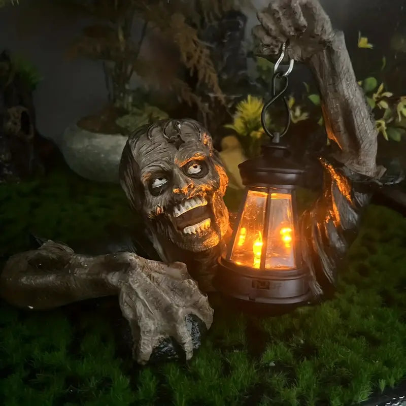 Realistic crawling zombie garden statue holding an LED lantern, made of hand-painted resin. — view 2