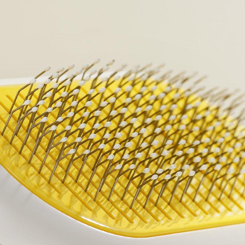 Ergonomic pet grooming comb with stainless steel bristles and a sleek capsule shape handle — view 5