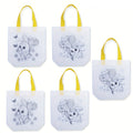 Five colorful reusable Easter tote bags featuring cute bunny and egg designs with sturdy carry handles
