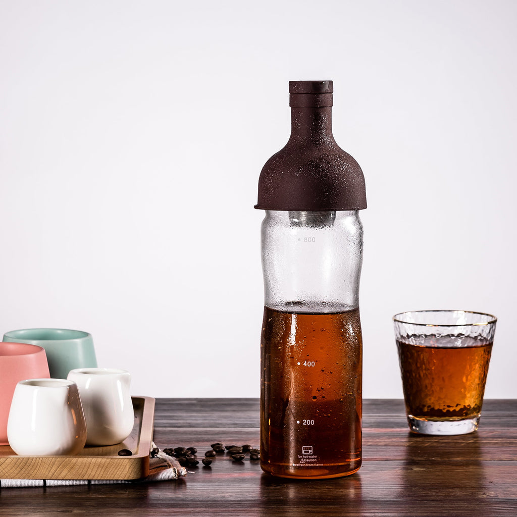Elegant glass coffee pot with filter and comfortable handle for cold brew and pour-over coffee.