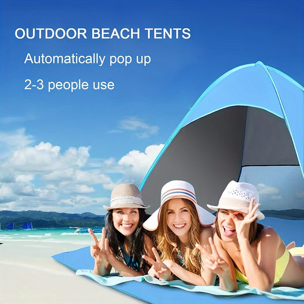 Portable waterproof beach tent in blue with sunshade pitched outdoors on sand — view 4