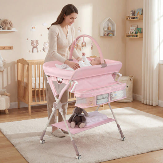 Black foldable baby changing table station with storage bag, bottom shelf, and wheels. — view 6