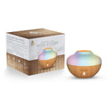 Portable essential oil aroma diffuser with color changing LED lights emitting a fine mist