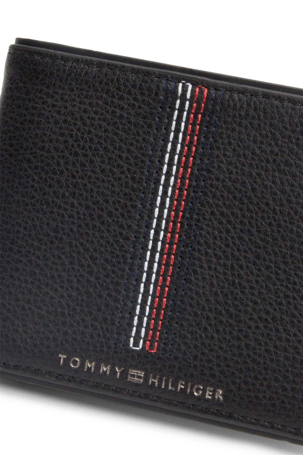 Navy blue hammered leather men's bifold wallet with iconic Tommy Hilfiger stitching and embossed logo