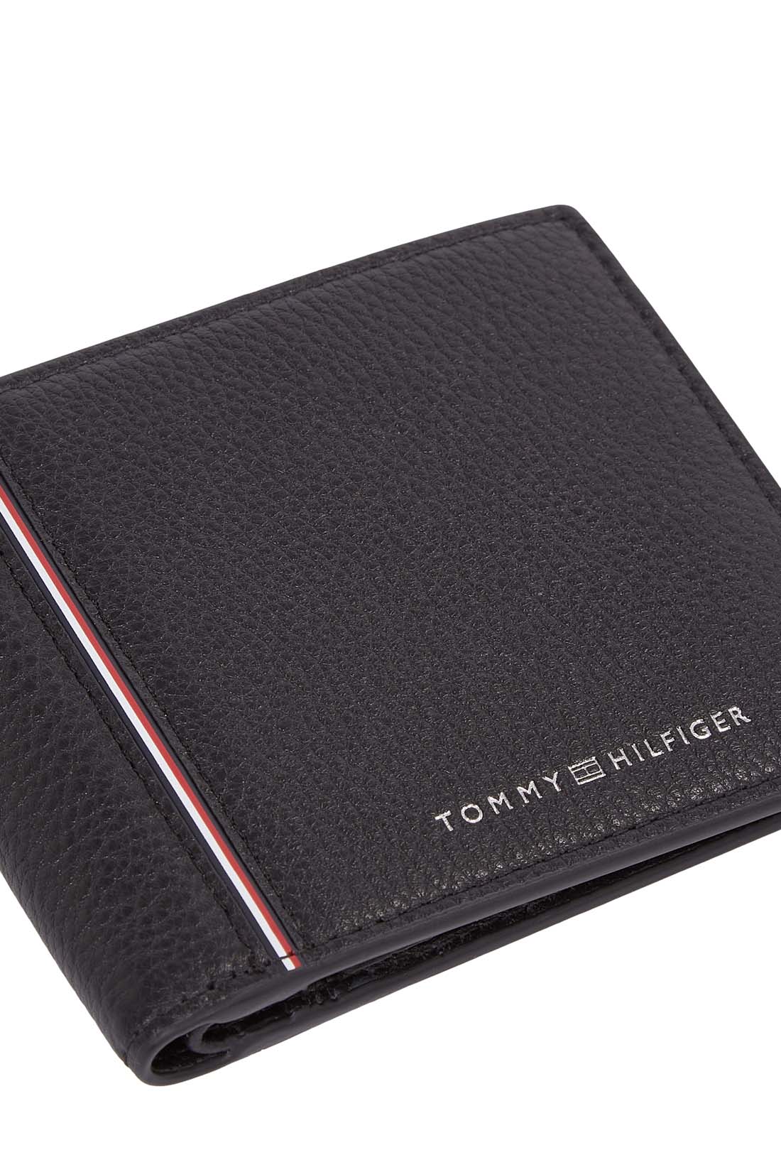 Men's black grained leather bifold wallet featuring card slots, coin pocket, and signature front branding.
