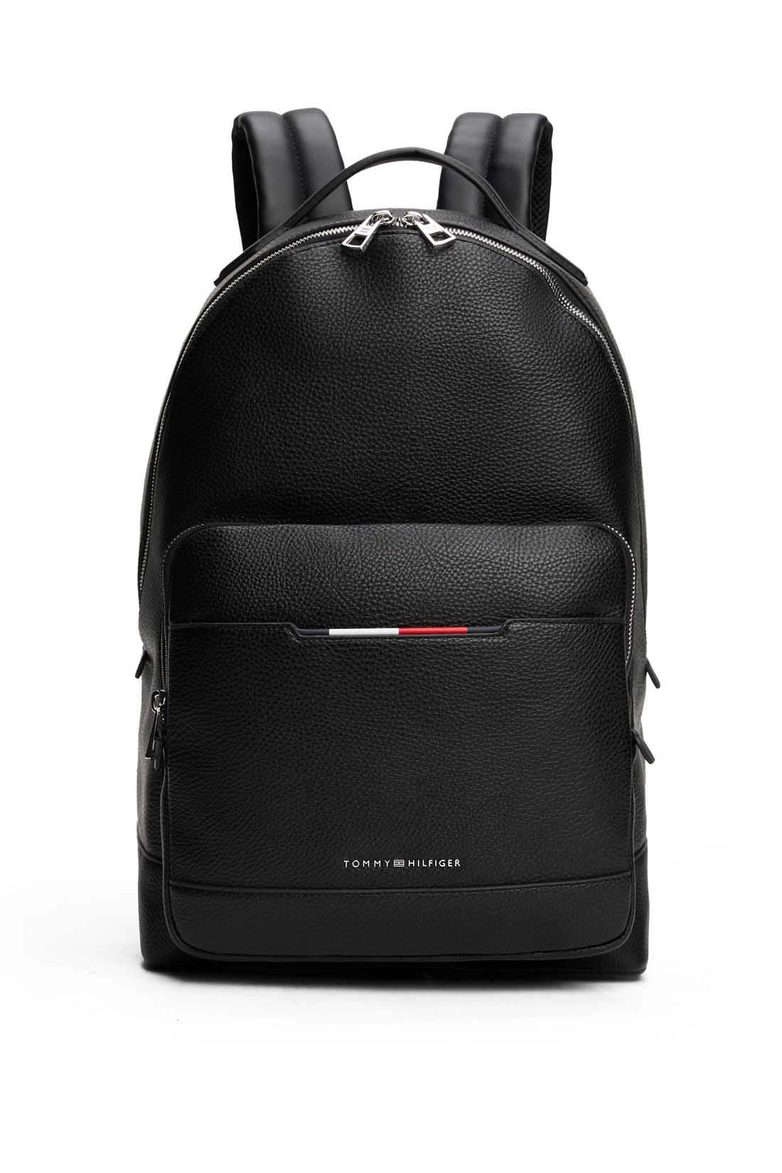 Men's black grained faux-leather backpack with double zip, front pockets, and metal logo detailing — view 10