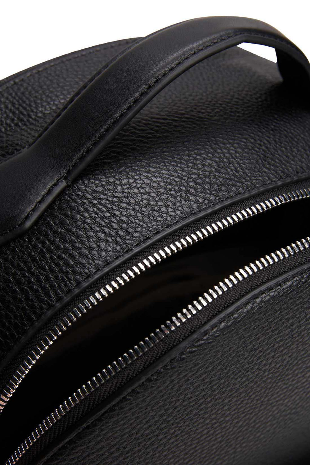 Men's black grained faux-leather backpack with double zip, front pockets, and metal logo detailing — view 6
