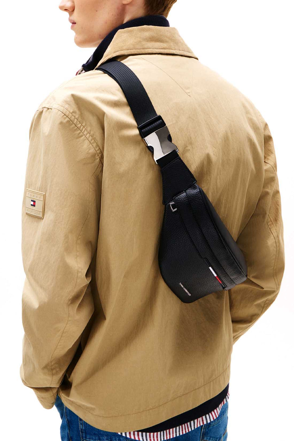 Men's black grained faux-leather bum bag with adjustable shoulder strap and front metal logo hardware. — view 4