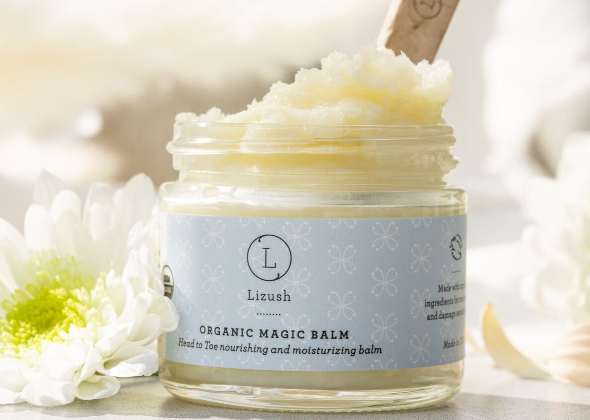 Organic baby skincare gift set in beautiful box featuring balms, oils, powder, and soft bibs — view 5