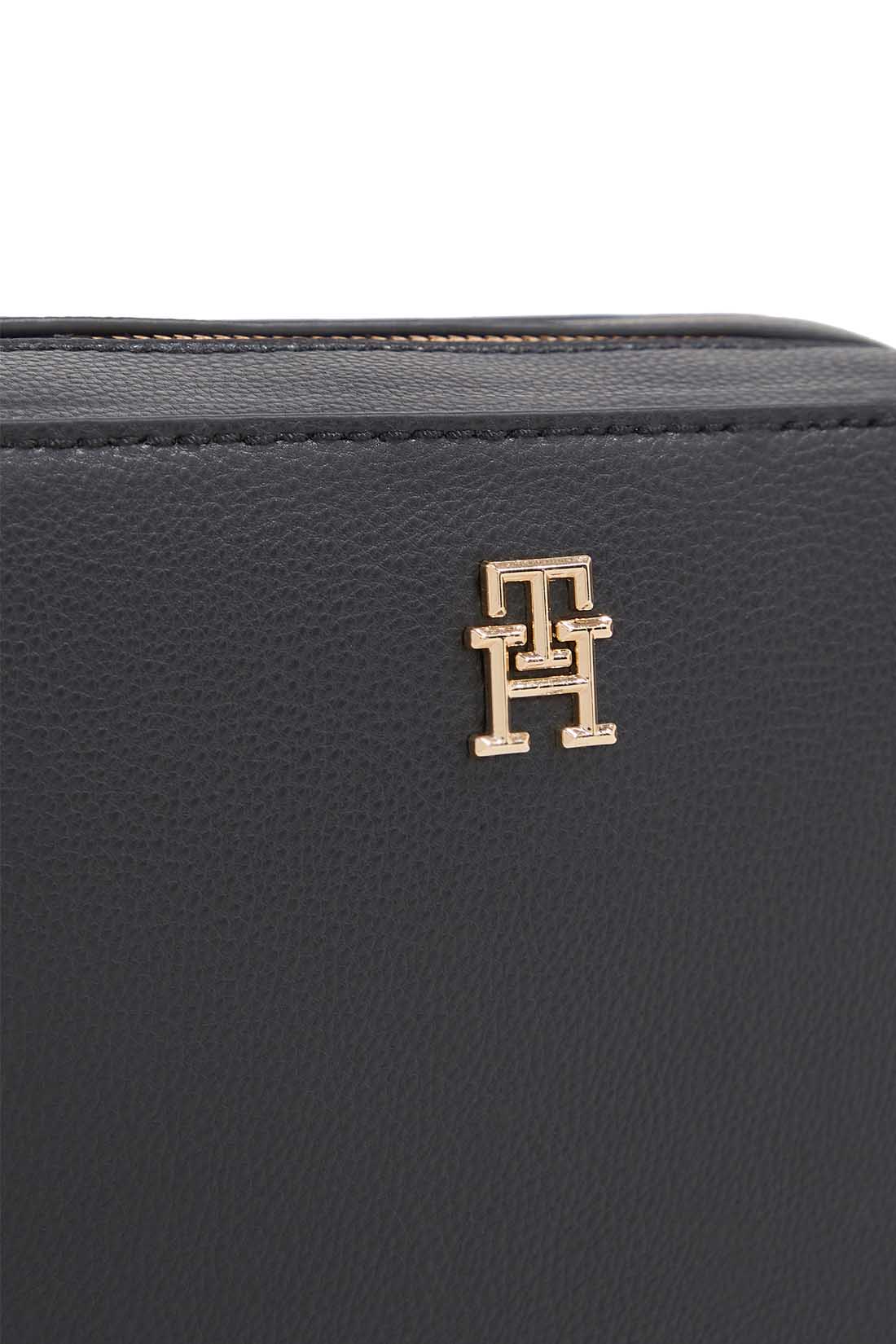 Women's black faux-leather crossbody shoulder bag with adjustable logo strap and front monogram plaque — view 2