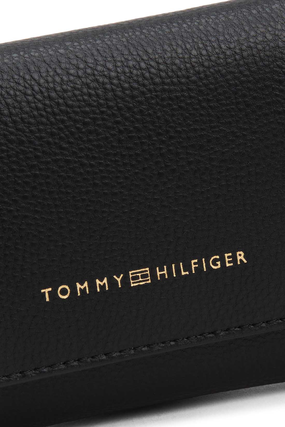 Black faux-leather women's wallet with embossed logo, front flap, and multiple compartments.