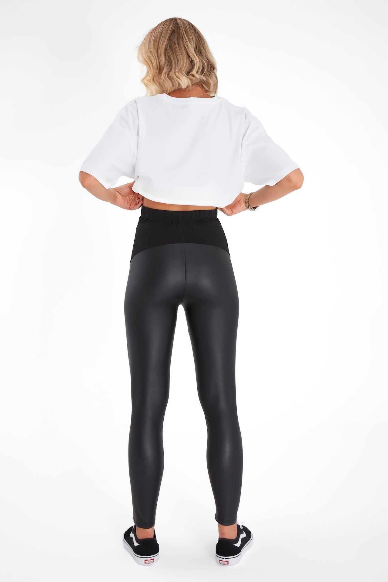 Black faux leather maternity leggings featuring a comfortable foldover cotton waistband — view 4