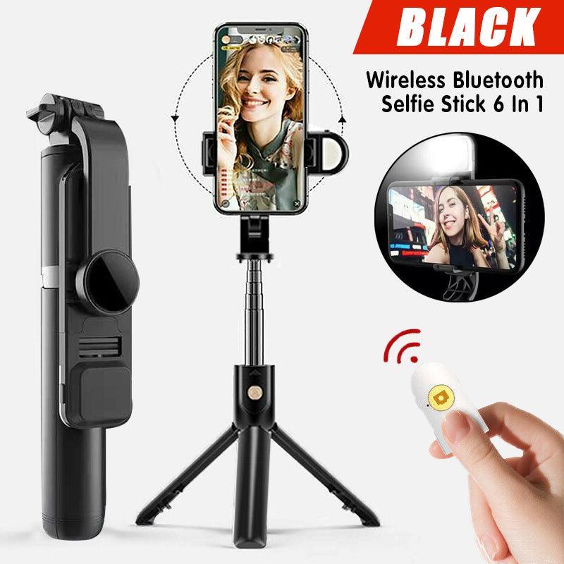 Wireless Bluetooth selfie stick tripod fully extended with smartphone mount and remote control attached