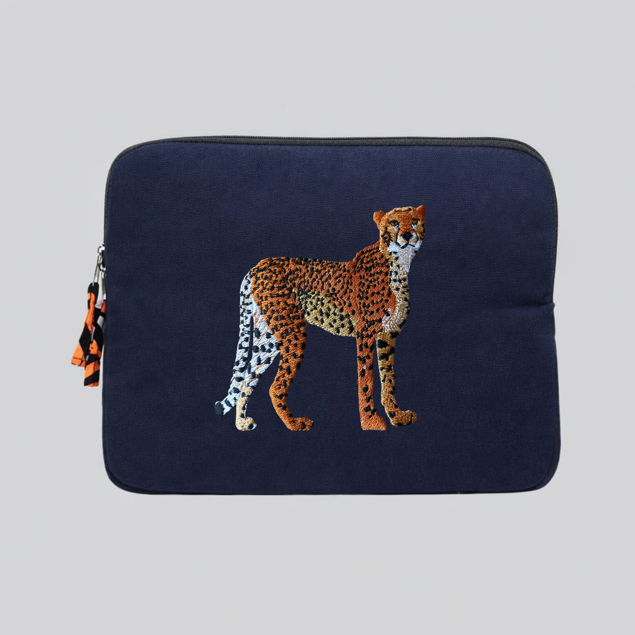 Handmade cotton canvas cheetah laptop sleeve in warm earthy tones featuring detailed animal embroidery — view 2