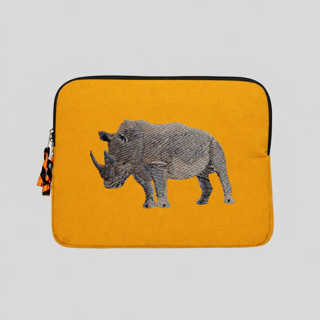 Rhino laptop sleeve made of Kenyan cotton canvas with animal embroidery in warm earthy colors — view 3