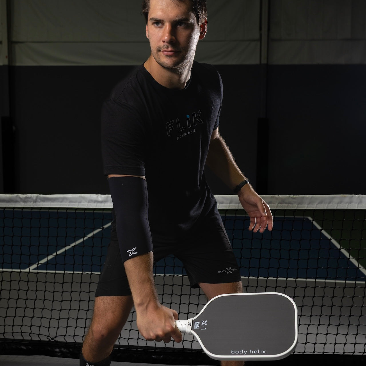 Full elbow compression sleeve made of stretch fabric for joint support and athletic injury recovery — view 4