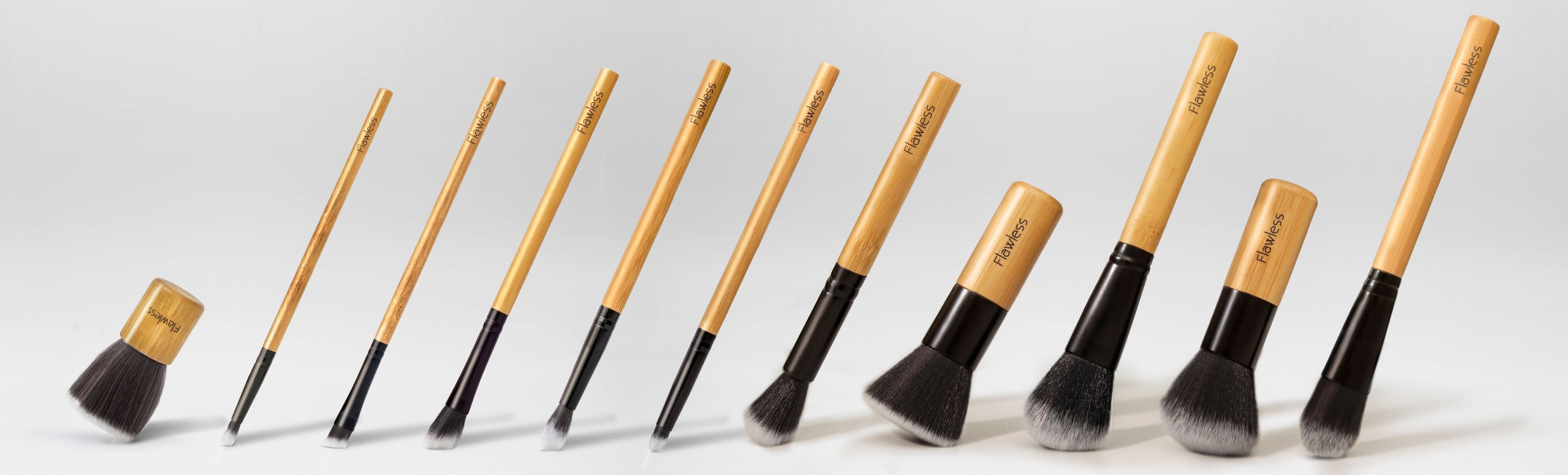 Sustainable 11-piece makeup brush set with bamboo handles and organic cotton storage bag
