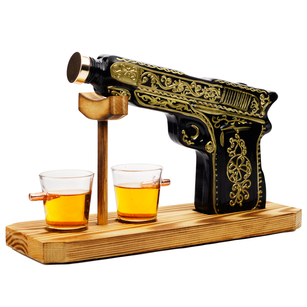Black and gold hand-painted pistol whiskey decanter with two shot glasses on wooden display stand