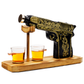 Black and gold hand-painted pistol whiskey decanter with two shot glasses on wooden display stand