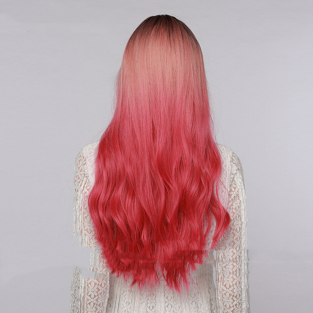 Long curly synthetic wig with straight bangs in black to strawberry pink ombre gradient — view 3
