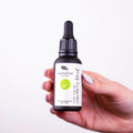 Anti-aging rose absolute essential oil blend in a 30ml glass dropper bottle for facial skincare