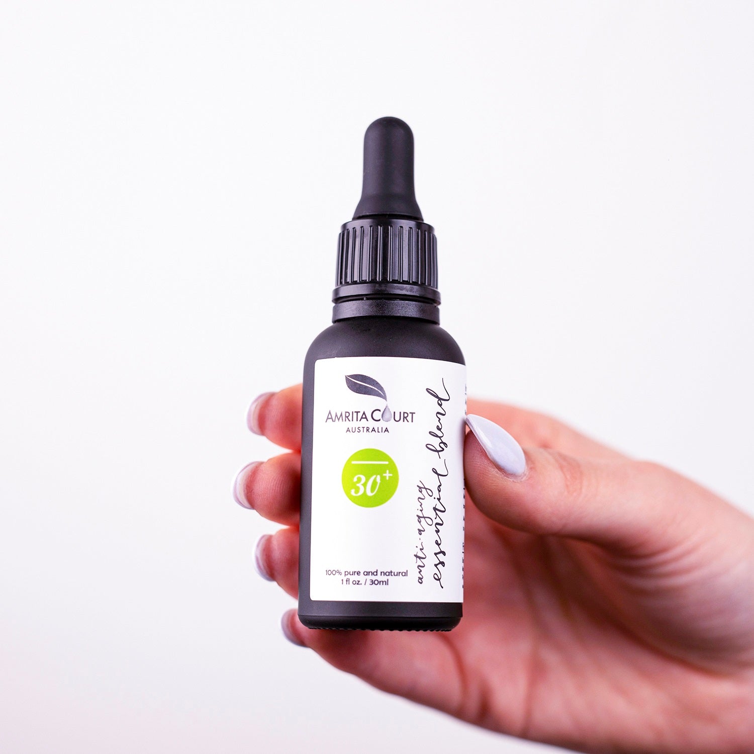 Anti-aging rose absolute essential oil blend in a 30ml glass dropper bottle for facial skincare