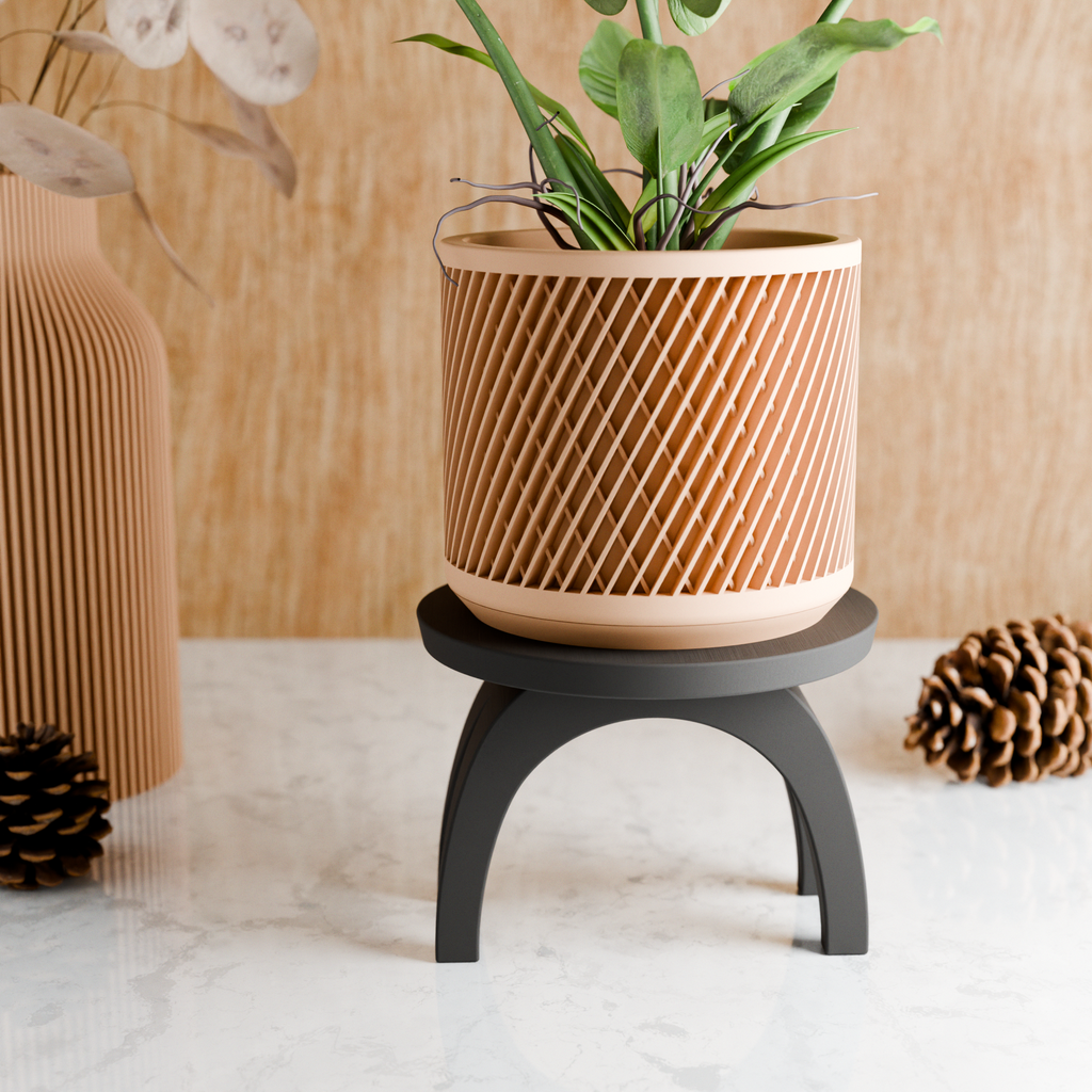 Modern ARC plant stand featuring a sleek curved design supporting an indoor potted houseplant — view 3