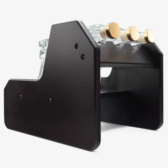 3-pistol whiskey decanter set made of glass resting on a rich mahogany wood display base — view 5