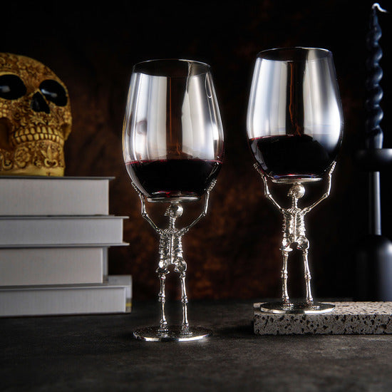 Skeleton stemmed wine glasses featuring silver finish bone stems and clear glass bowls — view 2