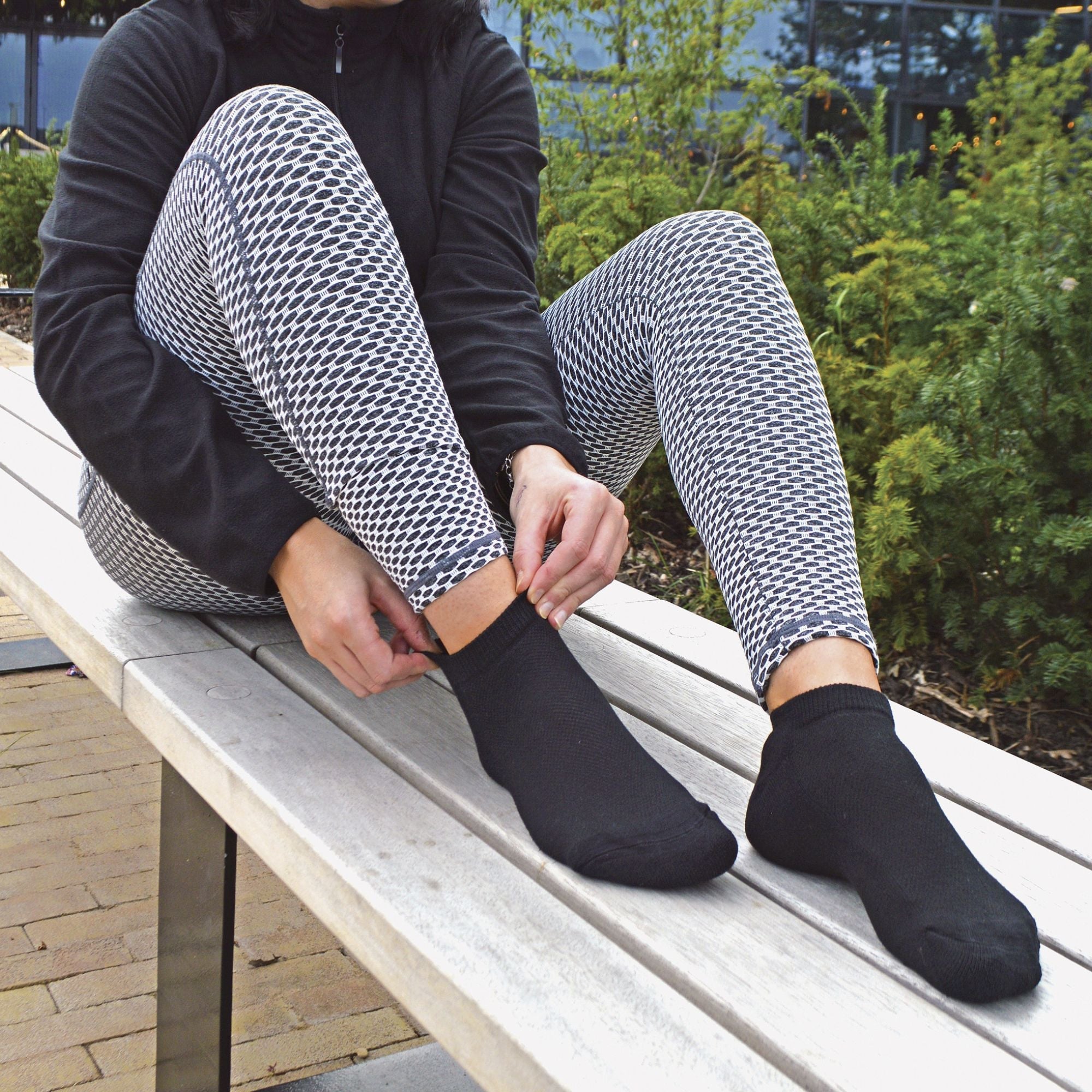 12-pack of kids low cut bamboo running socks in black and white with cushioned heels. — view 3