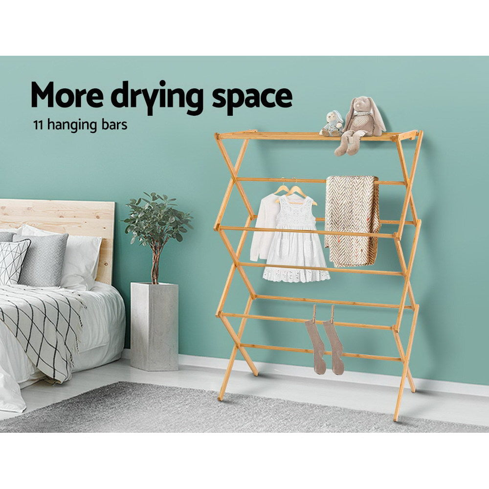 Natural bamboo foldable clothes drying rack with eleven hanging bars on a white background. — view 5